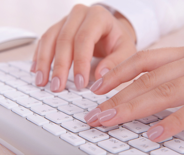 Person Typing on Keyboard