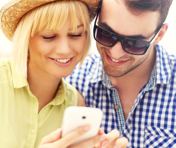 Man & Woman Looking at Cellphone
