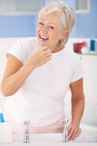 Older Woman Brushing Teeth